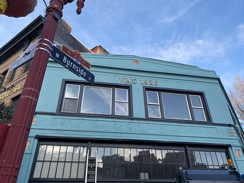 The exterior of a blue building on burnside